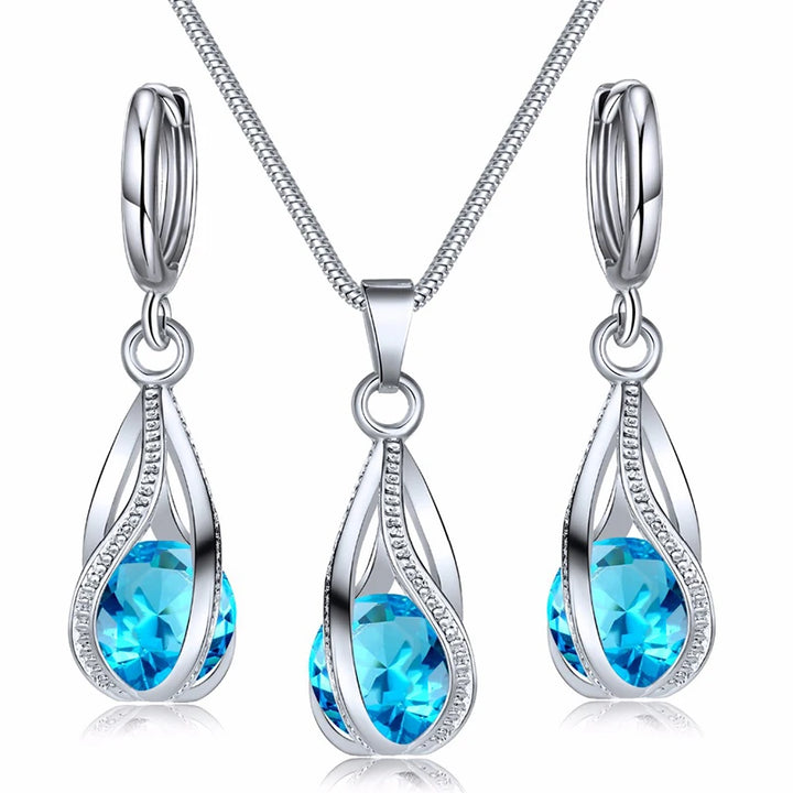 https://ae01.alicdn.com/kf/S9c9cc65e1cb44be1a44744a0b26e3761k/Obega-Cubic-Zirconia-Necklace-Set-Lantern-Design-Multi-Color-Stone-Pendant-Necklace-Drop-Earrings-Copper-Material.jpg